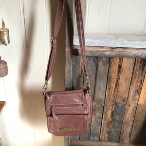 The sak brown leather cross body bag.